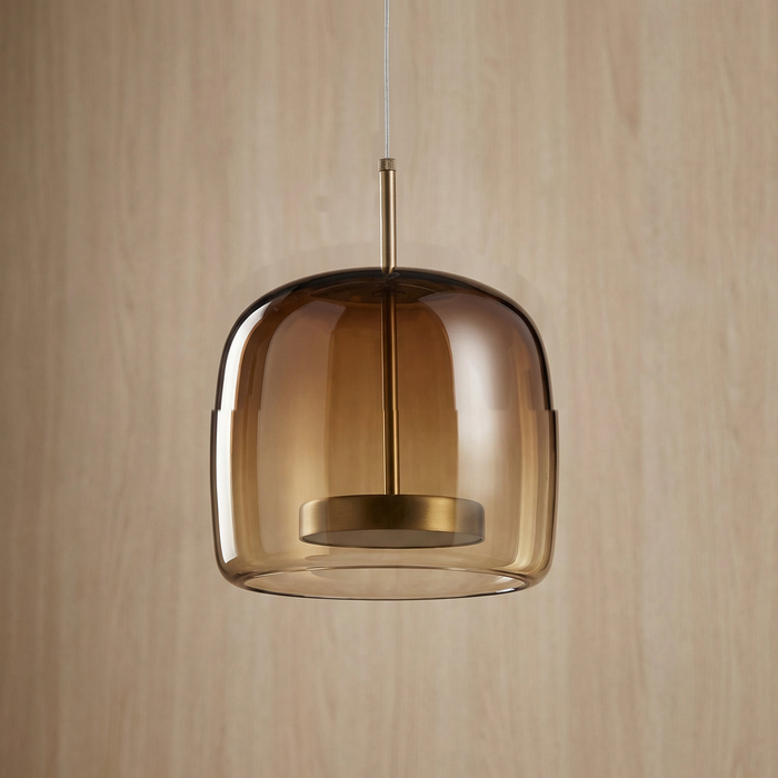 Whisky toned glass shade and knurled brass connector against a warm wood grain wall, BO-HA Astrid